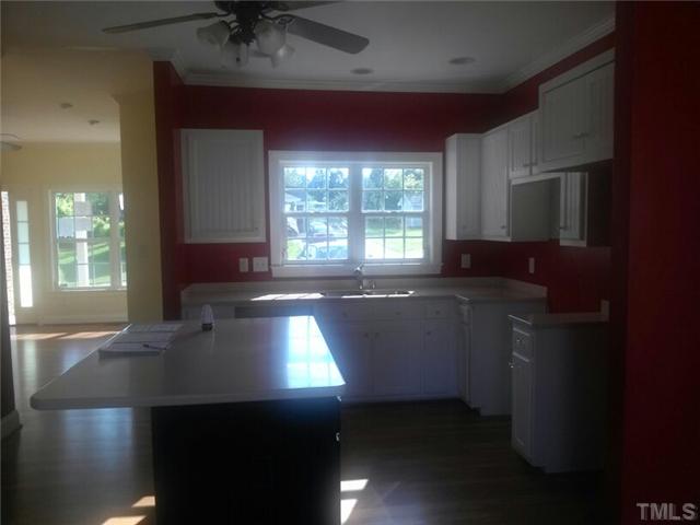 710 Ralph Graham Drive Graham, NC 27253 - Photo 7 of 14 Anotherview of kitchen...white cabinets reallly adds space to this area.
