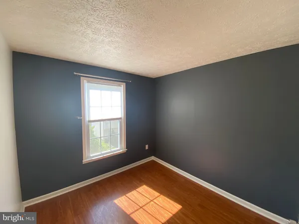 a view of balcony with wooden floor and fence