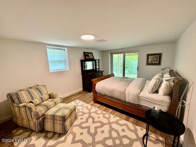 3067 Northgate Road Lake Ariel, PA 18436 - Photo 58 of 79 a bedroom with a bed and wooden floor
