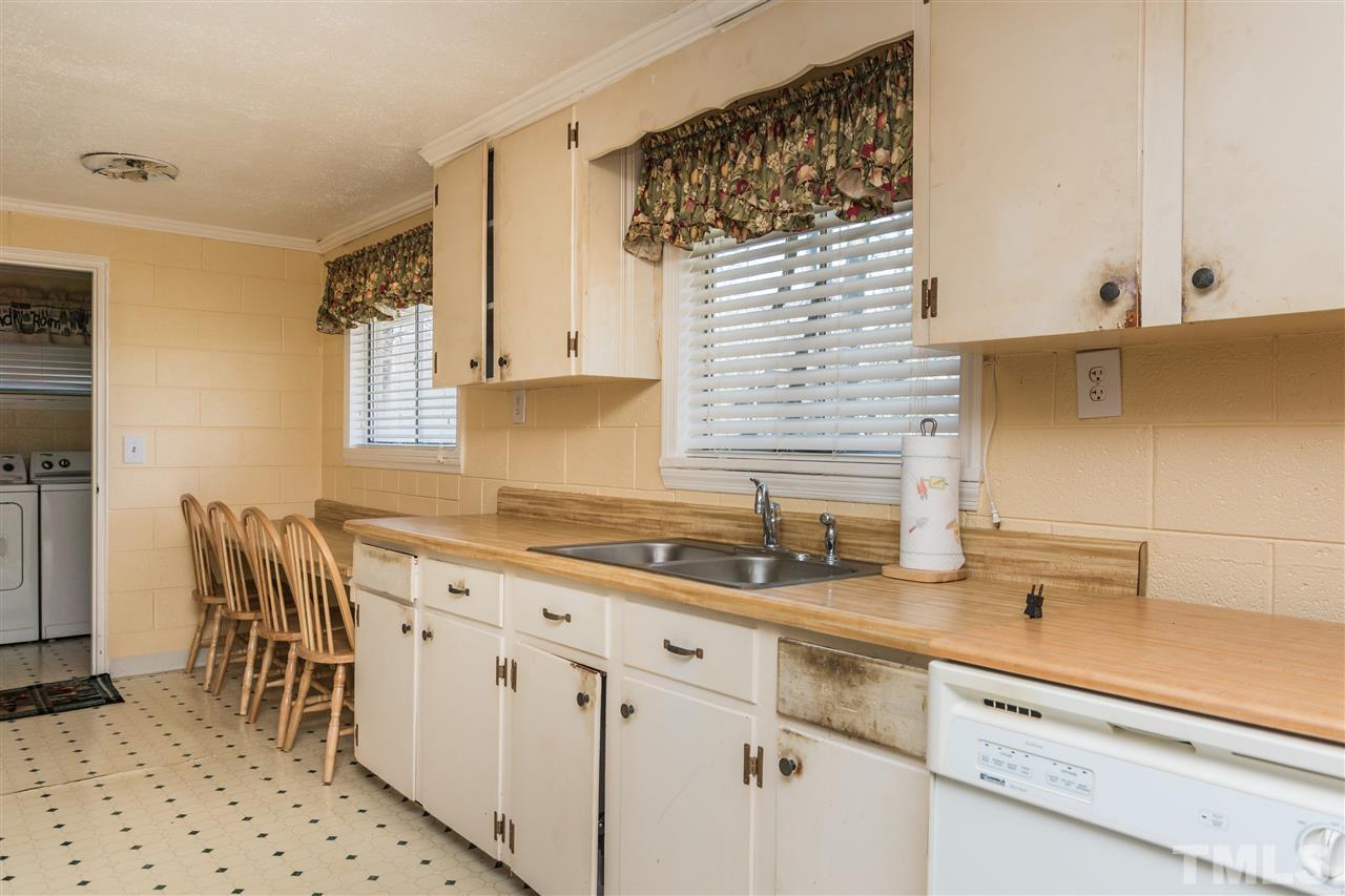 1016 Legend Road Raleigh, NC 27603 - Photo 11 of 21 a kitchen with a sink and cabinets
