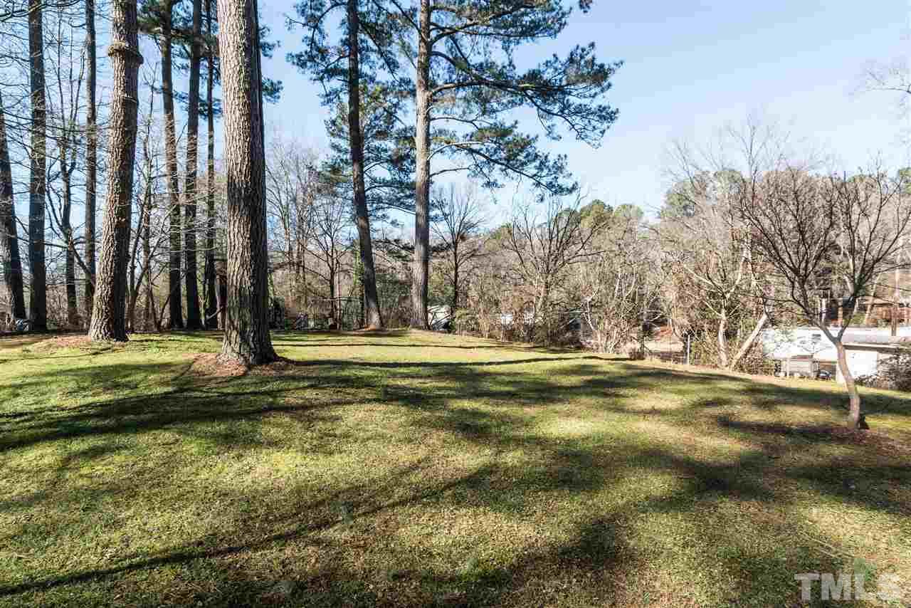 1016 Legend Road Raleigh, NC 27603 - Photo 19 of 21 a swimming pool with trees in the background