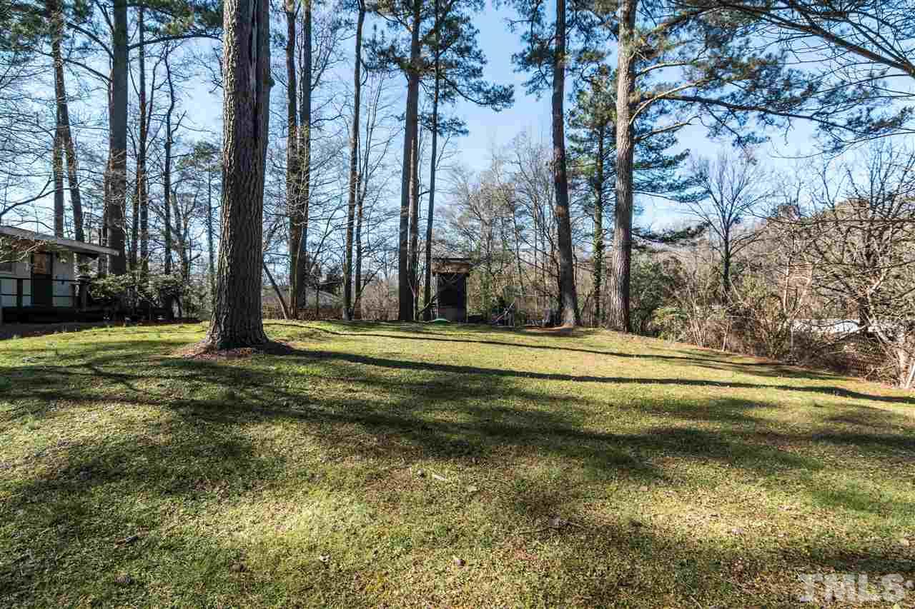 1016 Legend Road Raleigh, NC 27603 - Photo 20 of 21 a swimming pool with trees in the background