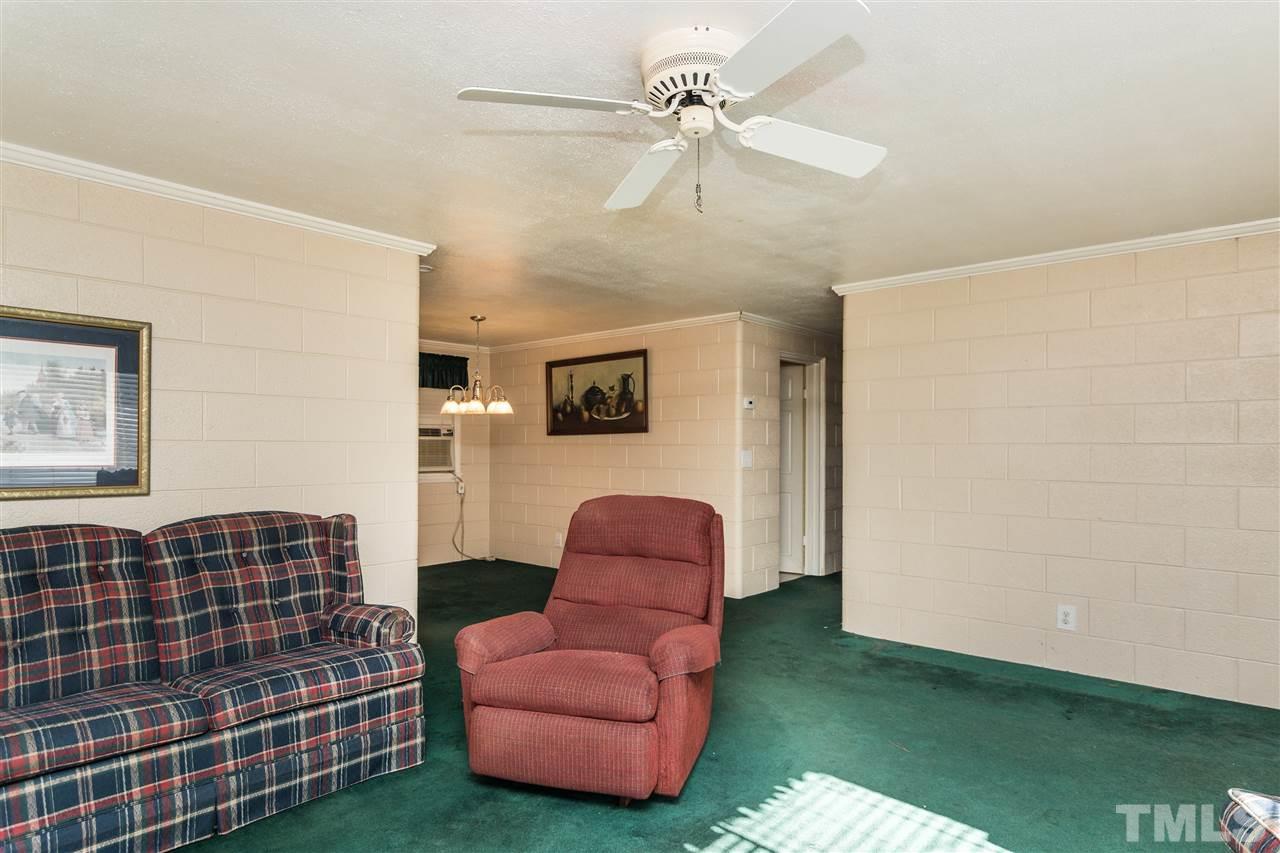 1016 Legend Road Raleigh, NC 27603 - Photo 4 of 21 a living room with furniture and a rug