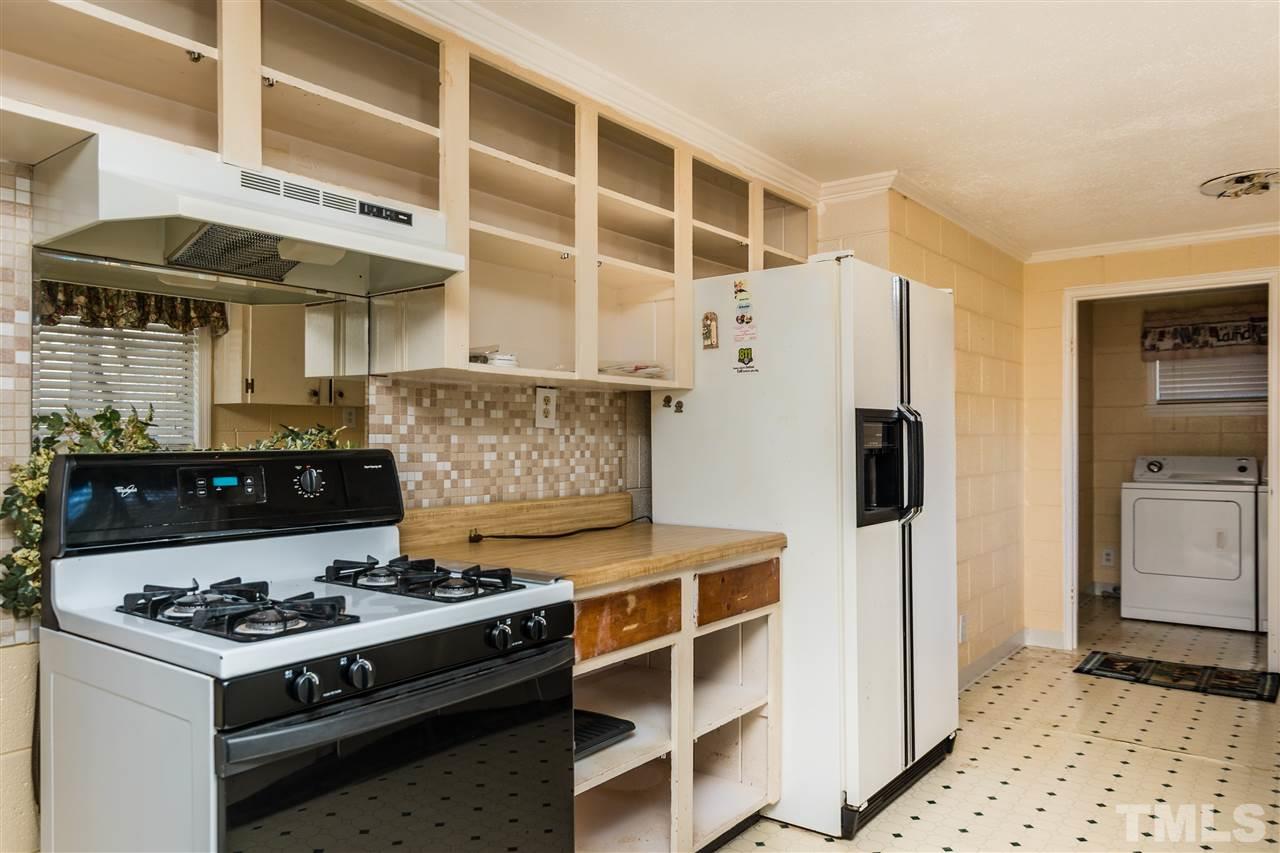 1016 Legend Road Raleigh, NC 27603 - Photo 9 of 21 a kitchen with a stove and a refrigerator