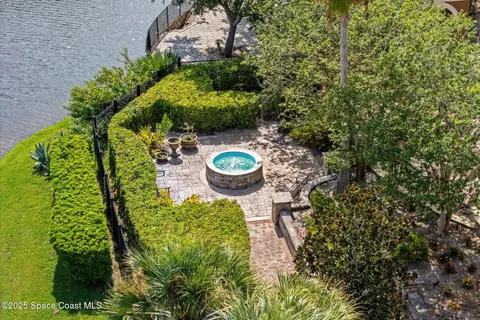 a backyard of a house with a yard and outdoor seating