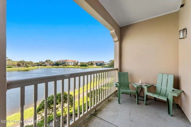 a view of a balcony with chairs
