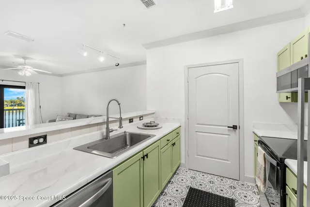 a kitchen with a sink and a refrigerator