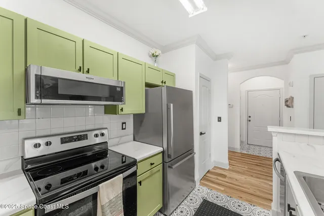 a kitchen with a stove and a microwave