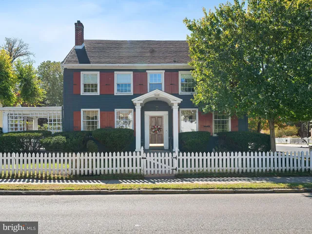 a front view of a house with a fence