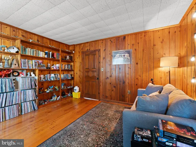 a bedroom with furniture and a book shelf