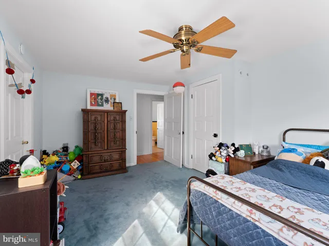 a bed room with a bed and a baby bed