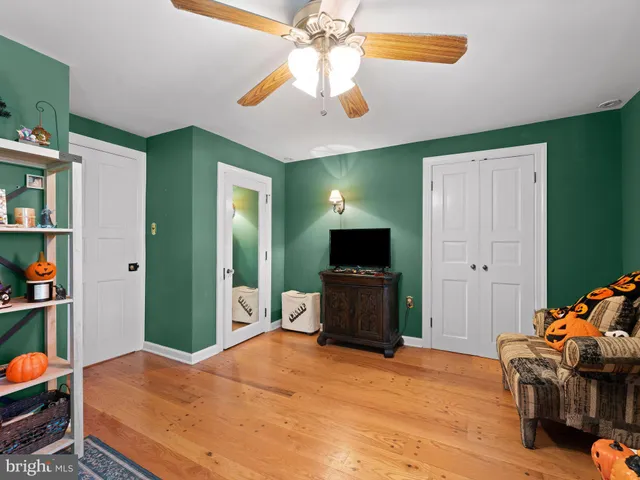 a bedroom with a bed and a television