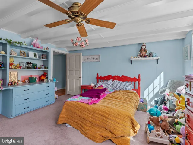 a bedroom with a bed and a window in it