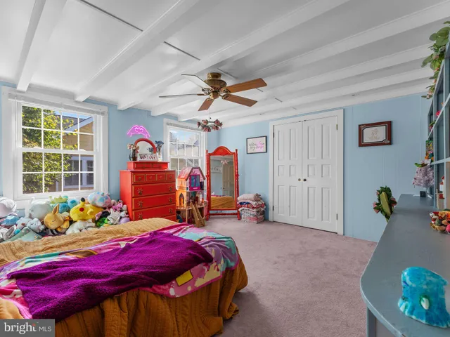 a bedroom with furniture and a bed