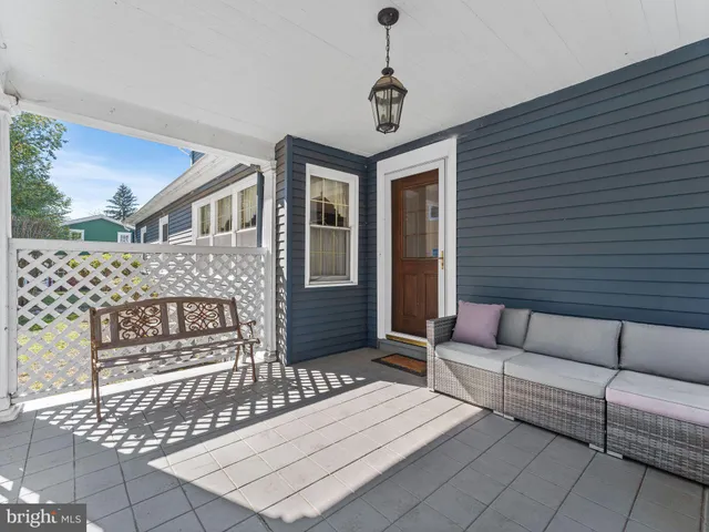 a view of a patio with couches and potted plants