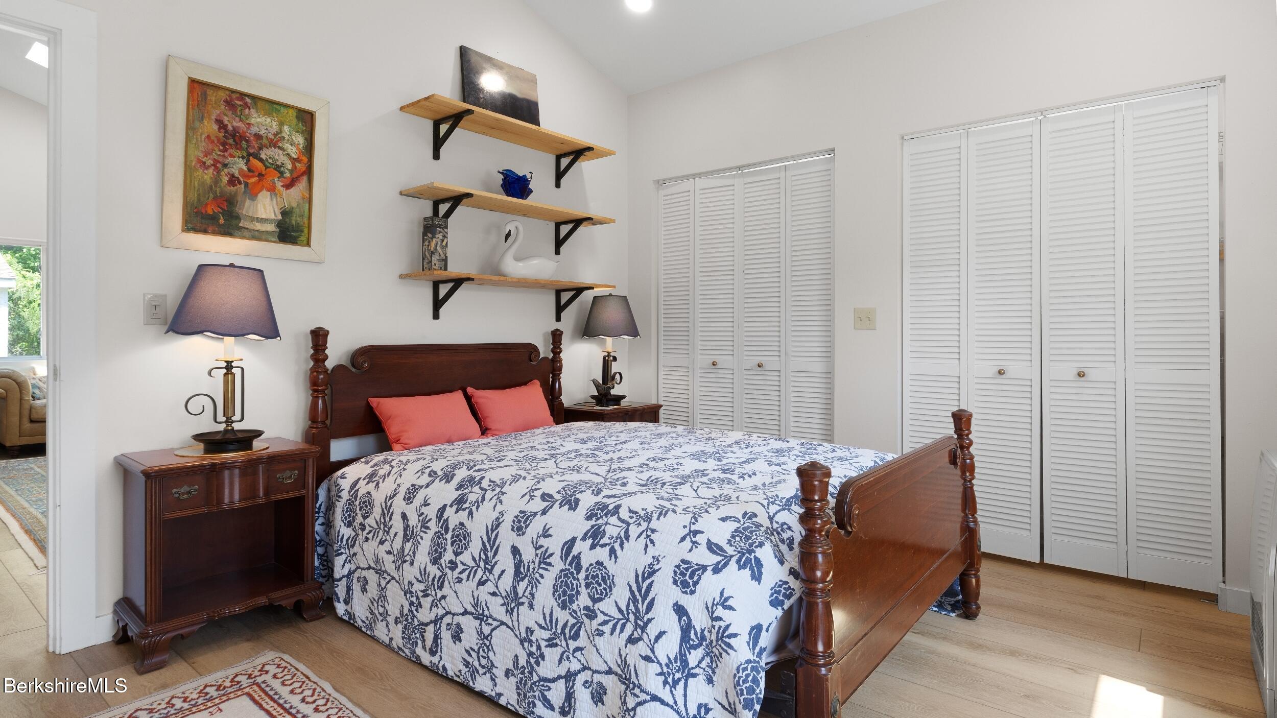20 East Dugway Road Lenox, MA 01240 - Photo 63 of 84 a bedroom with a bed and a chandelier