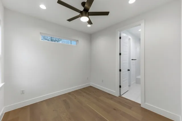 a bathroom with a sink a toilet a tub and shower