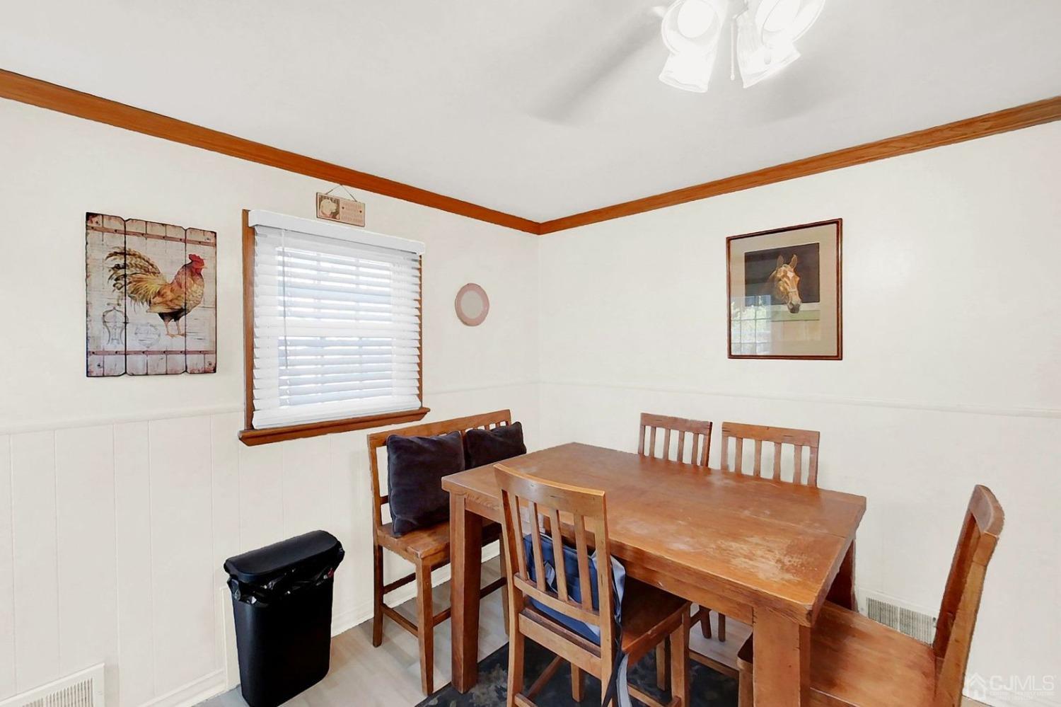 137 Kimberly Road Colonia, NJ 07067 - Photo 16 of 39 a view of a dining room with furniture and wooden floor