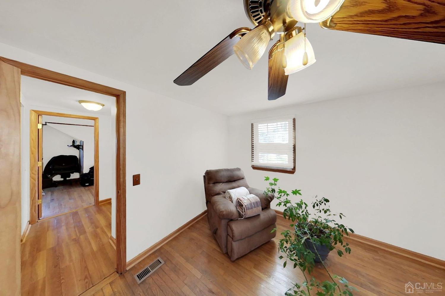 137 Kimberly Road Colonia, NJ 07067 - Photo 25 of 39 a living room with furniture and a potted plant