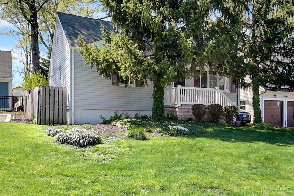 137 Kimberly Road Colonia, NJ 07067 - Photo 3 of 39 a view of backyard with garden and trees