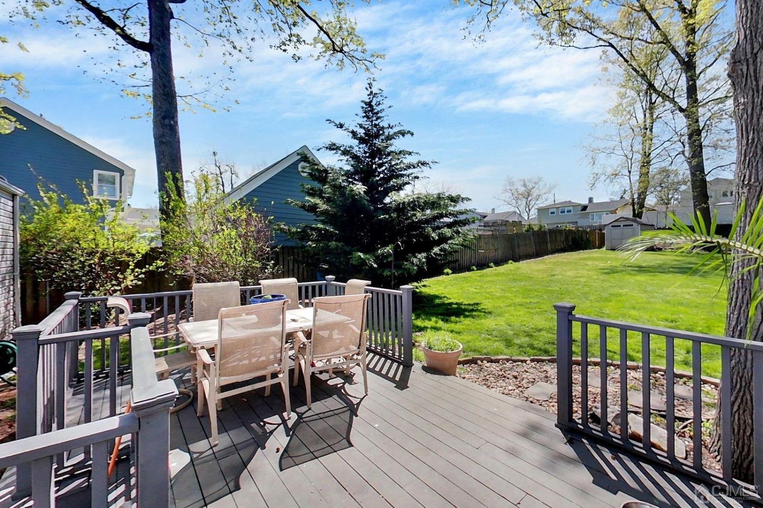 137 Kimberly Road Colonia, NJ 07067 - Photo 36 of 39 a view of a table and chairs on the roof deck