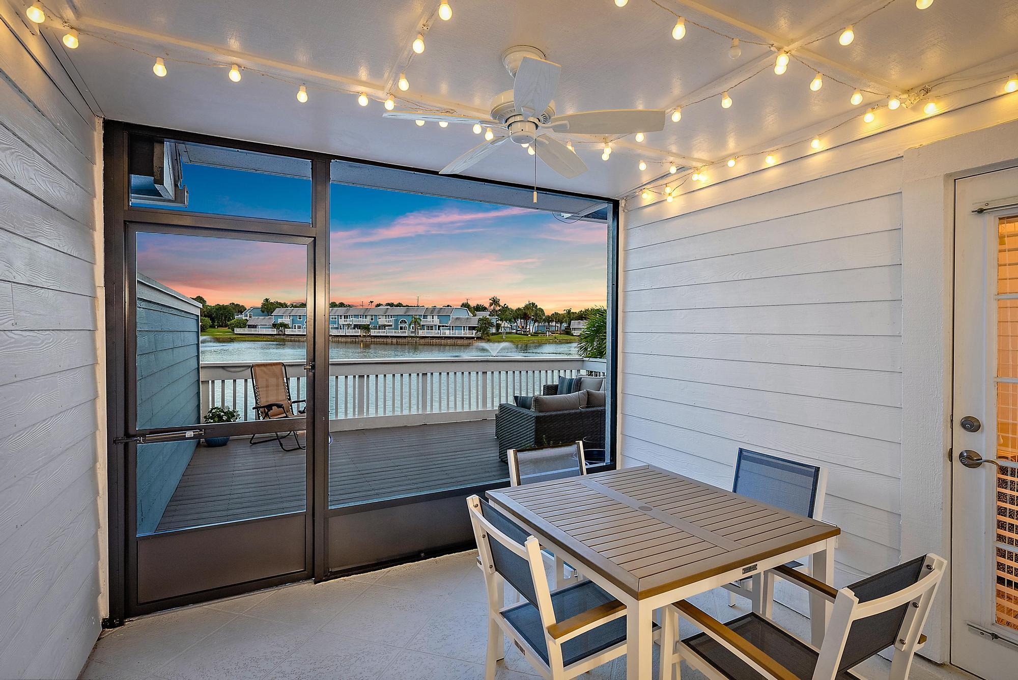 1219 Ocean Dunes Circle Jupiter, FL 33477 - Photo 11 of 35 a view of a terrace with furniture and a table