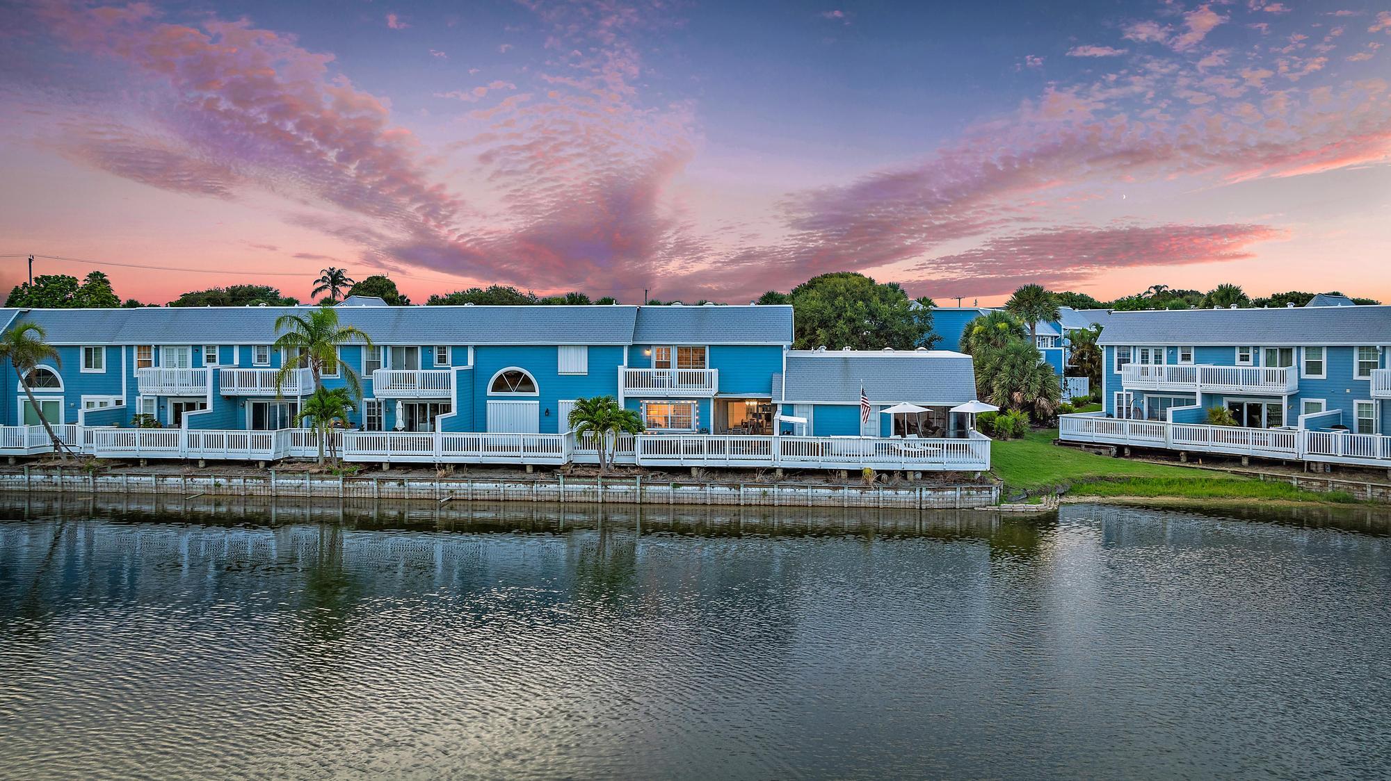 1219 Ocean Dunes Circle Jupiter, FL 33477 - Photo 12 of 35 a view of building with river in front of it