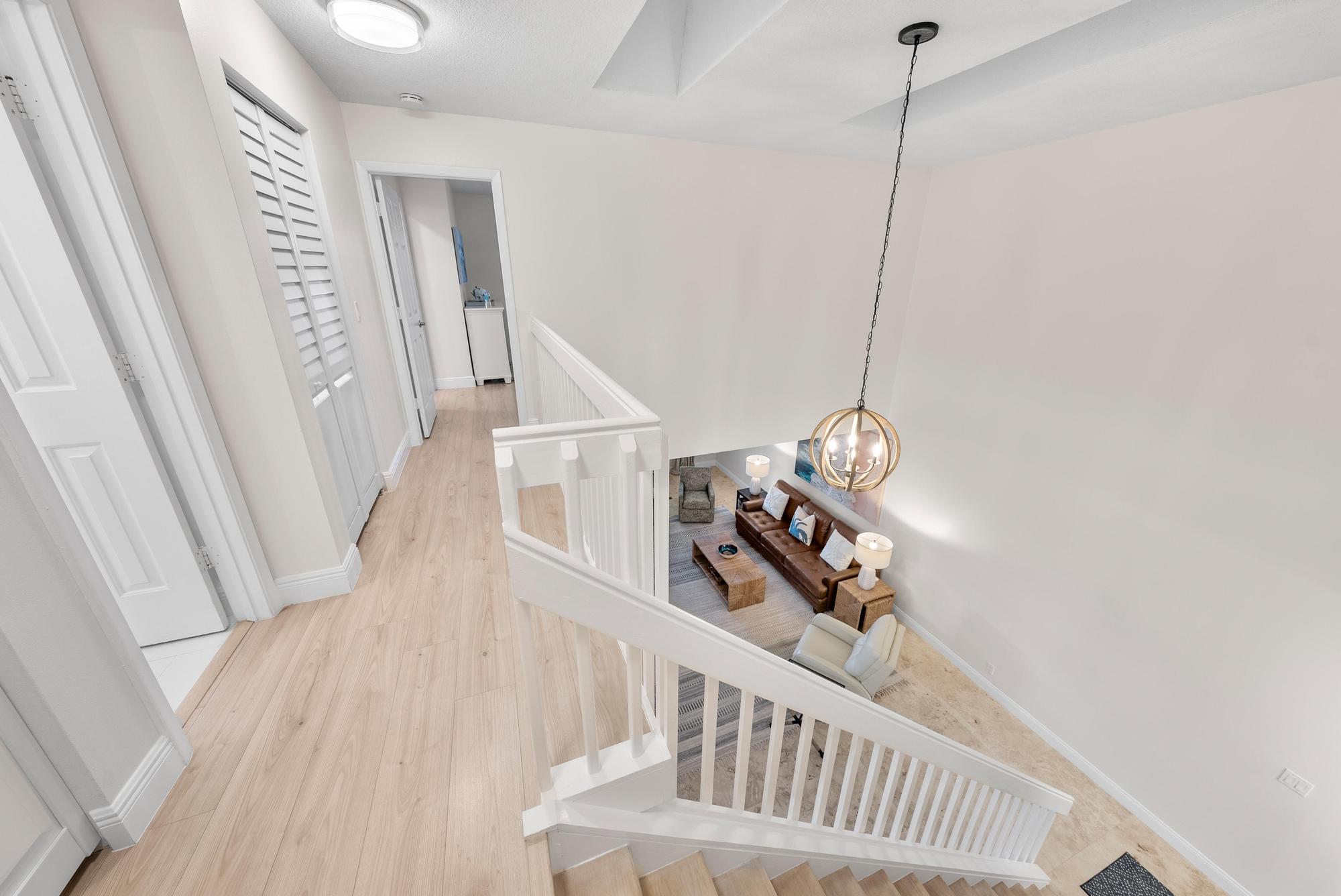 1219 Ocean Dunes Circle Jupiter, FL 33477 - Photo 17 of 35 a view of a hallway with stairs