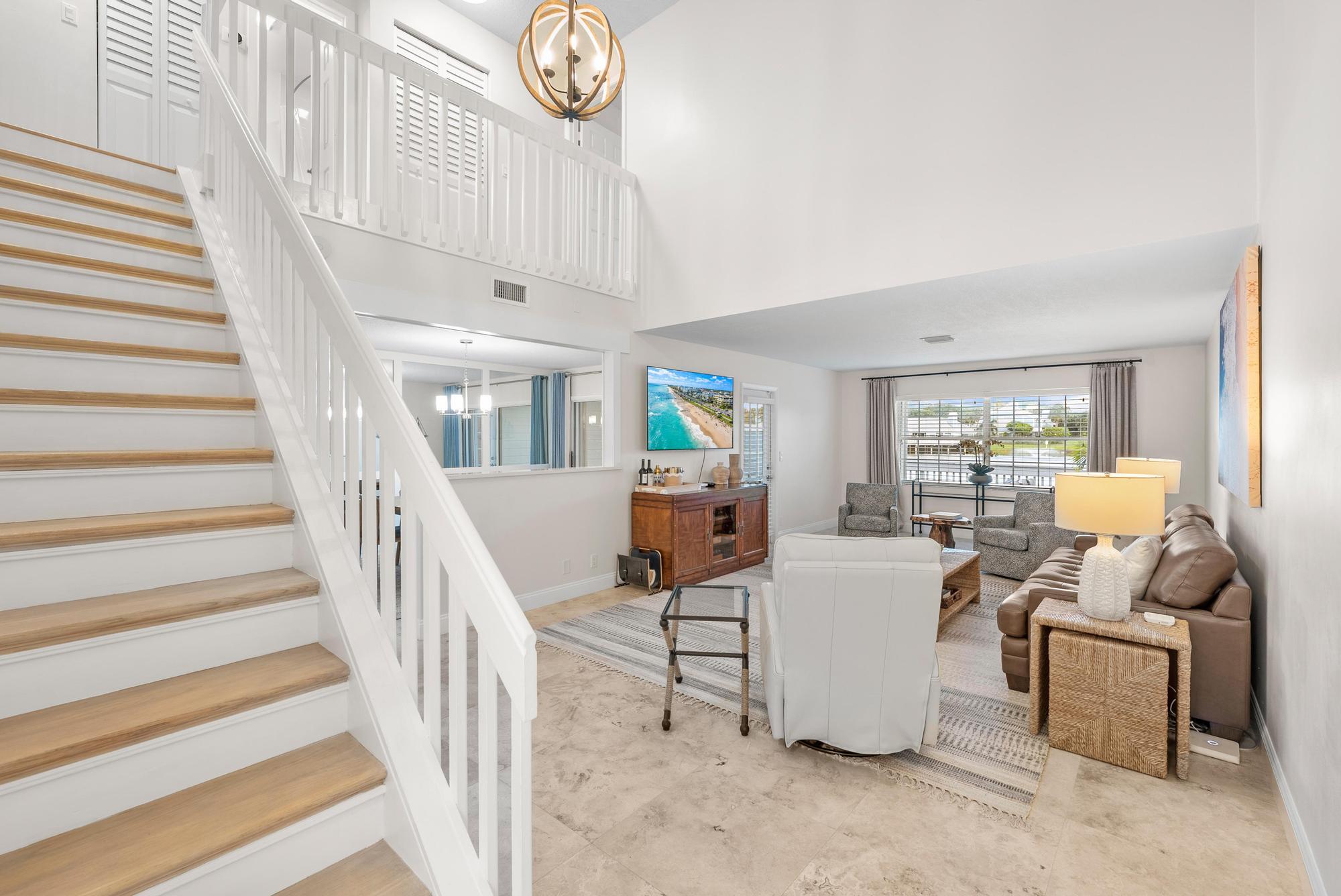 1219 Ocean Dunes Circle Jupiter, FL 33477 - Photo 21 of 35 a living room with furniture and a large window