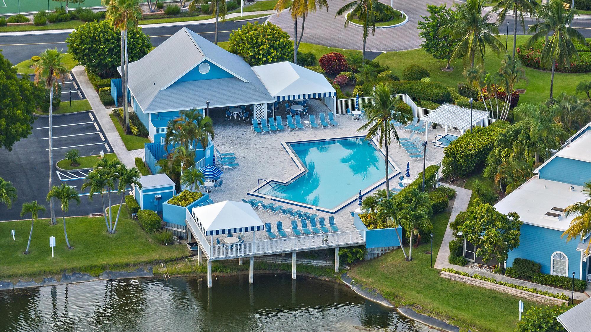 1219 Ocean Dunes Circle Jupiter, FL 33477 - Photo 34 of 35 a balcony with table and chairs