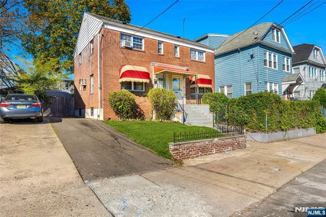 a front view of a building with garden