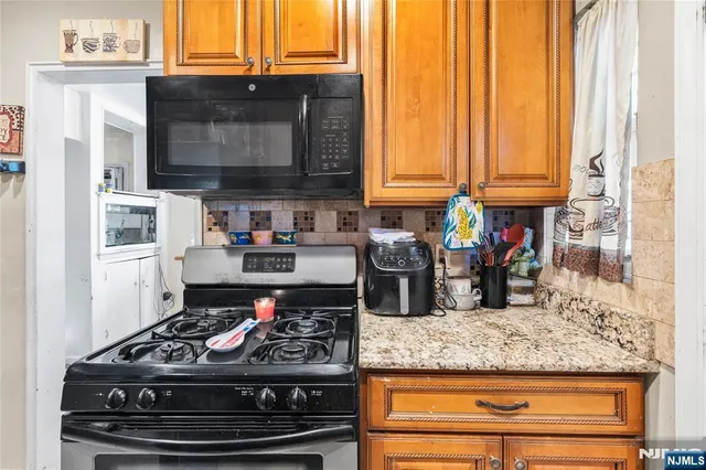 a kitchen with a stove and a microwave