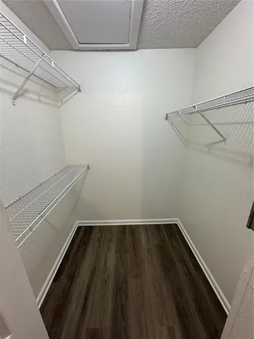 a view of a room with racks on the wall