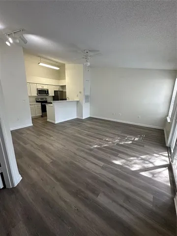 a view of a kitchen with a sink cabinets and a window