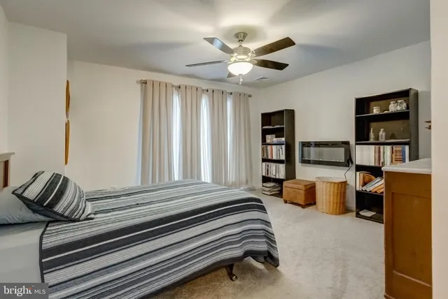 a bedroom with furniture and a window