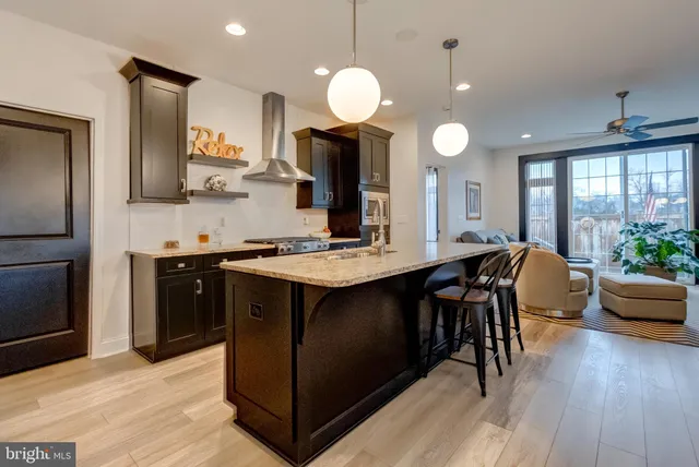 a kitchen with counter space appliances and a chair