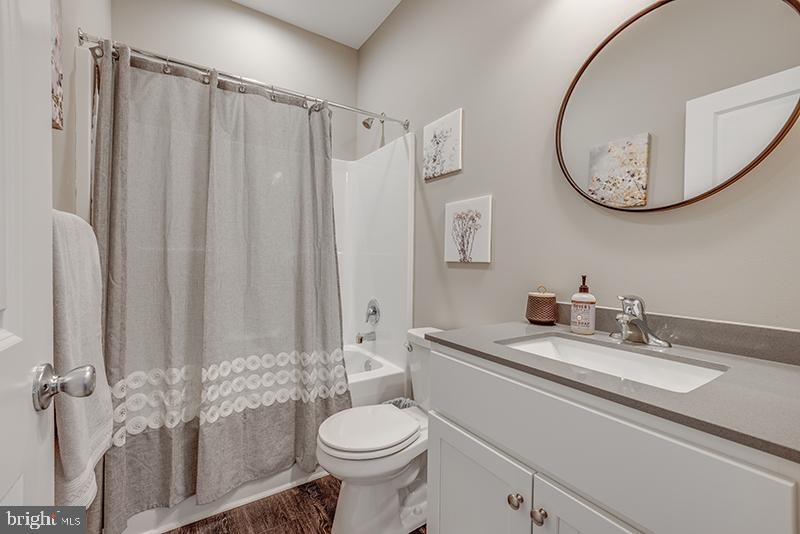 38 High Ridge Road Felton, DE 19943 - Photo 21 of 51 a bathroom with a sink a toilet and a mirror
