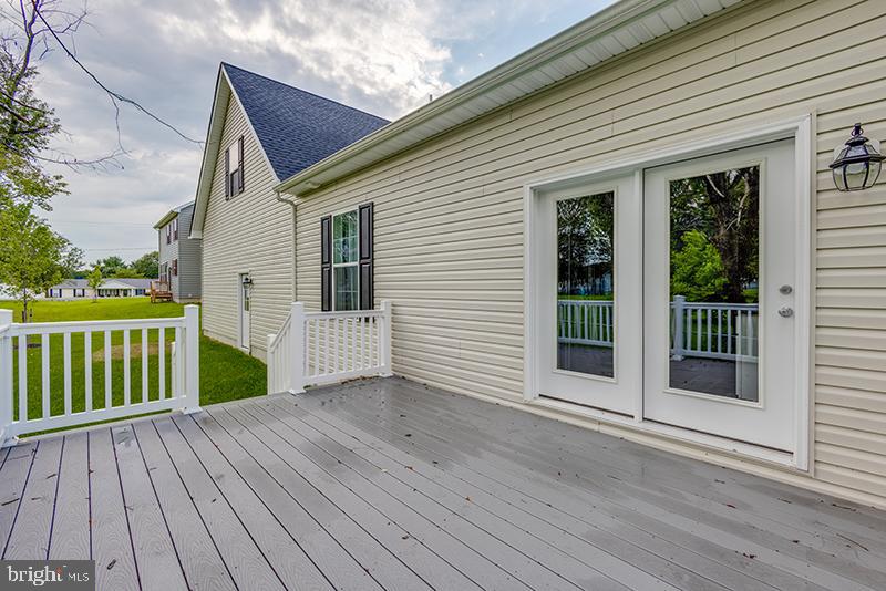 38 High Ridge Road Felton, DE 19943 - Photo 9 of 51 a view of a house with wooden deck