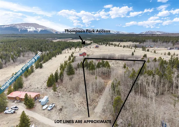 a view of a lake with a floor to ceiling window