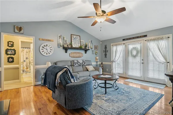 a living room with furniture and a rug