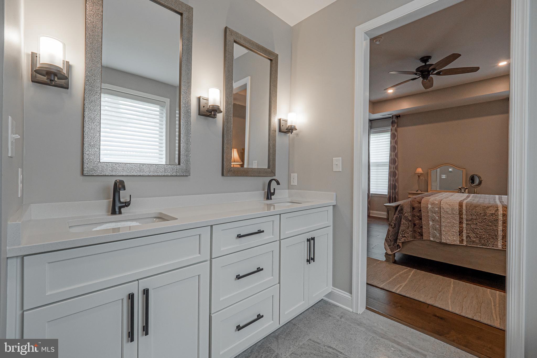 8 Timber Mill Lane, Unit TAGLIO Landenberg, PA 19350 - Photo 26 of 42 a en suite bathroom with double sink a mirror and a shower
