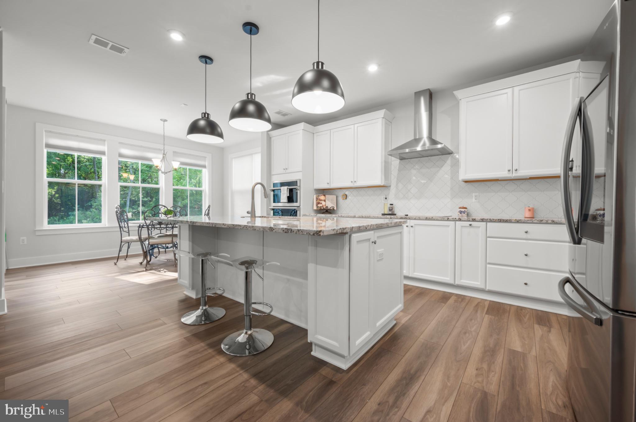 8702 Southrun Road Lorton, VA 22079 - Photo 11 of 35 One of a kind pendant lighting over breakfast bar