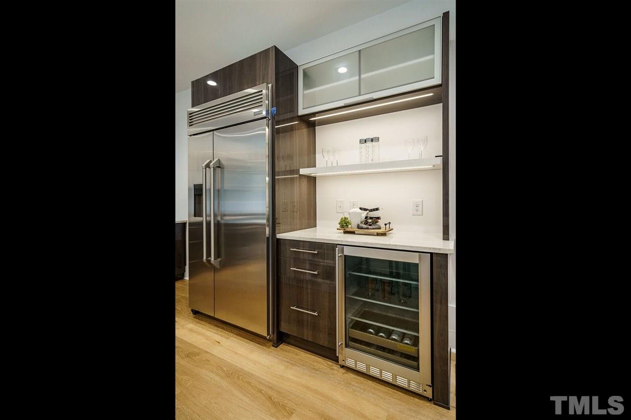 1619 Lorraine Road Raleigh, NC 27607 - Photo 13 of 30 Great Bar service area with Beverage Refrigerator. This handy spot offers a great place to show off barware. There is a custom (deep) drawer to store liquor bottles in an upright position.