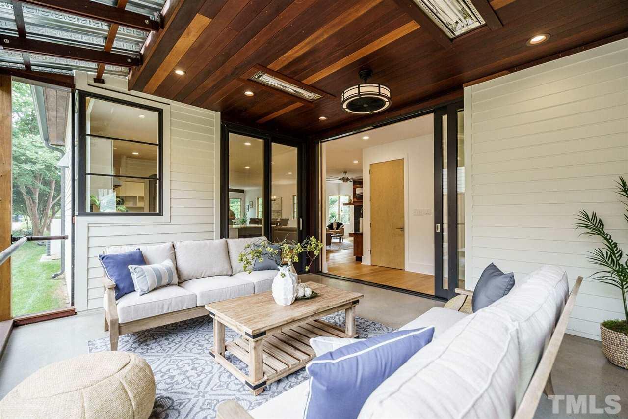 1619 Lorraine Road Raleigh, NC 27607 - Photo 15 of 30 WOW! Really more of a three-season room due to the two overhead radiant heaters. Polished concrete floors, steel ceiling detail, rot/insect proof Brazilian Teak accents. Marvin door packages include a slider opening to the Kitchen + a FULLY POCKETING Door