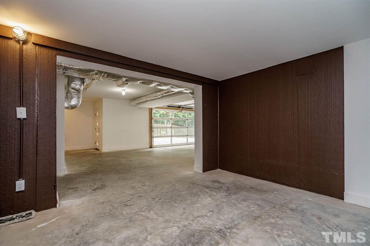 1619 Lorraine Road Raleigh, NC 27607 - Photo 25 of 30 Heated and cooled by an efficient whisper-quiet mini split. Basement walls are insulated concrete with a thermal break. This room could serve as a safe room in the event of a tornado.
