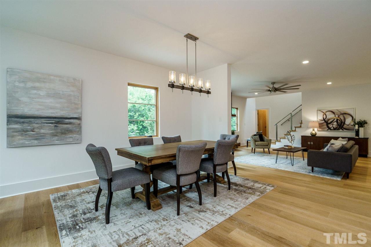 1619 Lorraine Road Raleigh, NC 27607 - Photo 5 of 30 The entire Main Floor is flooded with light from Coastal-Rated Custom Marvin Windows, but is at once cozy and private. The Open Plan space is an Entertainer's dream.