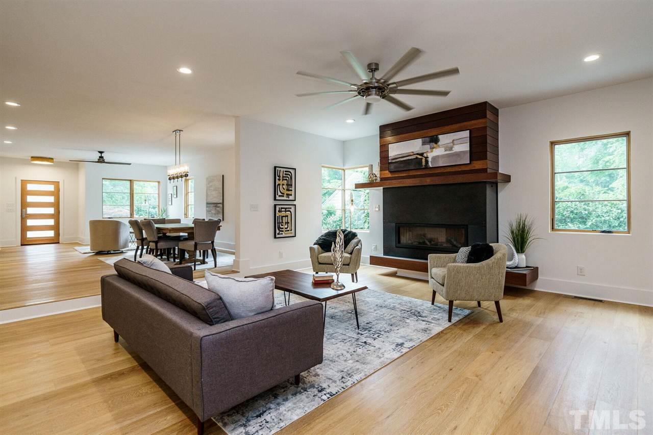 1619 Lorraine Road Raleigh, NC 27607 - Photo 8 of 30 There is a one-step transition from the Living Room, Dining Room area into the Family Room. Open, filled with light.