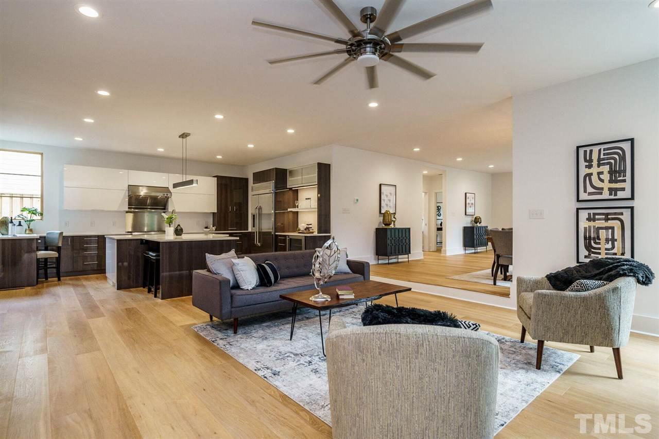 1619 Lorraine Road Raleigh, NC 27607 - Photo 9 of 30 The large Island features White Quartz and is a great place for casual dining with bar-stool seating or multiple prep or serving areas. There is hidden-panel cabinetry under the island for additional storage as well as USB ports.
