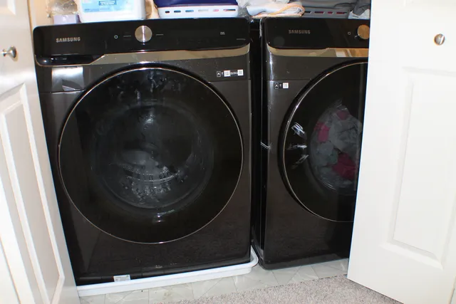 a bedroom with a bed and a table