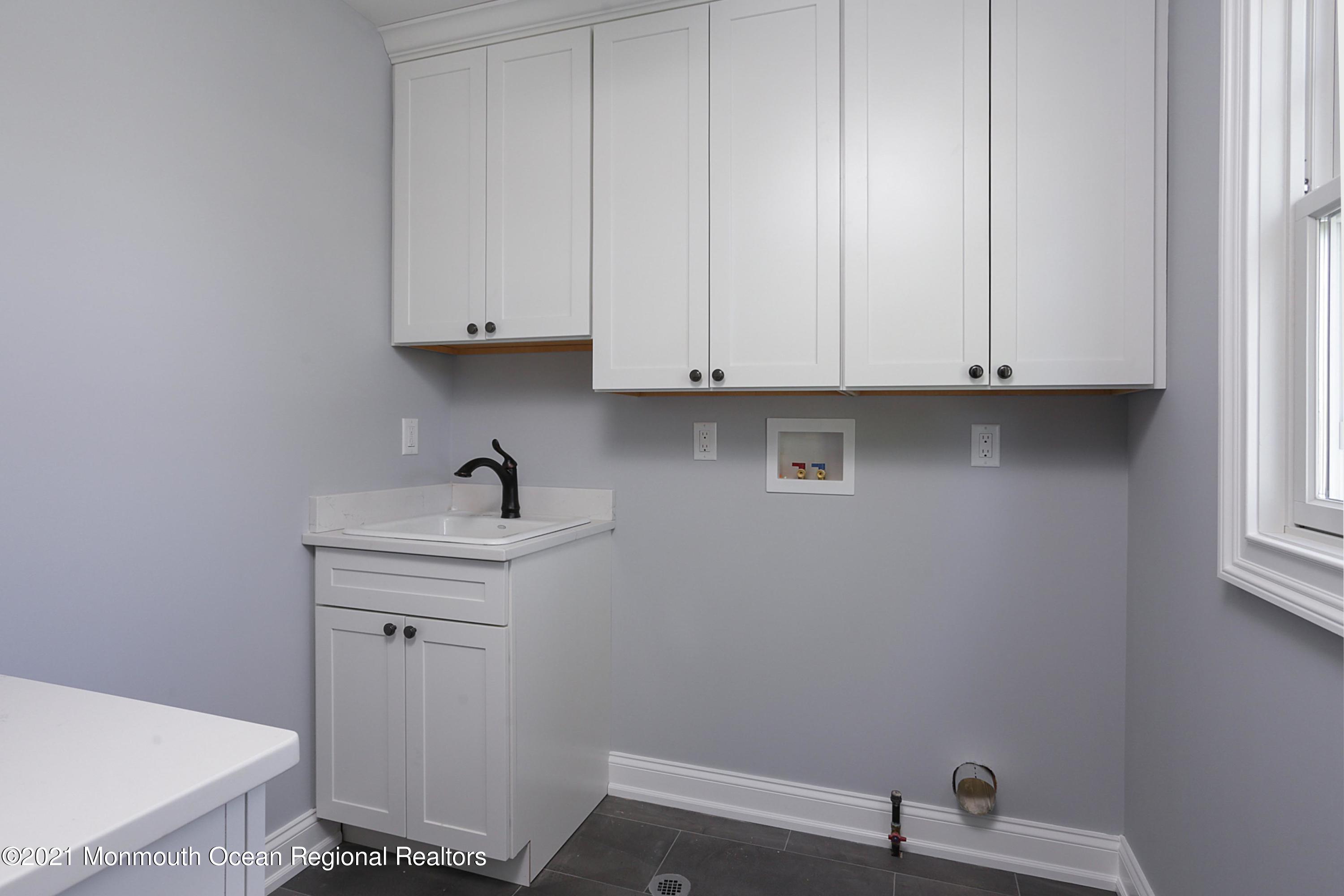 1 Meadowbrook Avenue Rumson, NJ 07760 - Photo 7 of 7 a view of cabinets and utility room